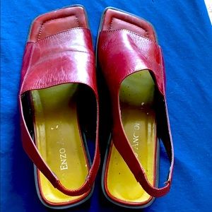 Maroon open toe shoes with strap. Leather